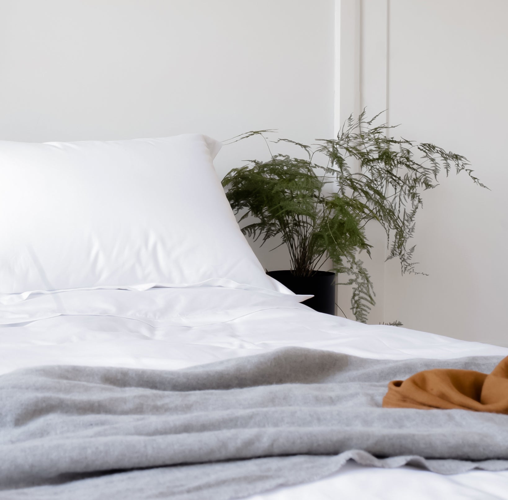 Wool Throw on a Duvet Cover on a Bed | Scooms