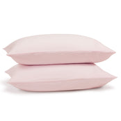 Pink linen pillowcase pair on pillows. Scooms