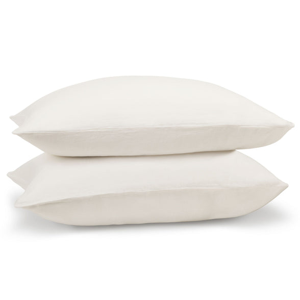 White linen pillowcase pair on pillows. Scooms