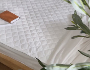 100% cotton mattress protector on bed | scooms