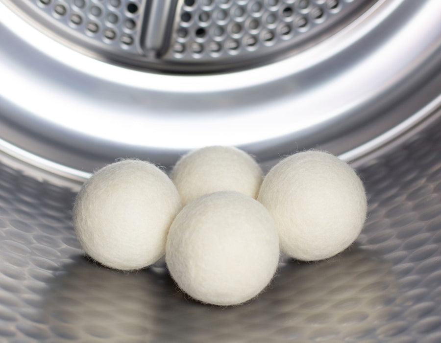 Four wool dryers balls with scooms branded bag