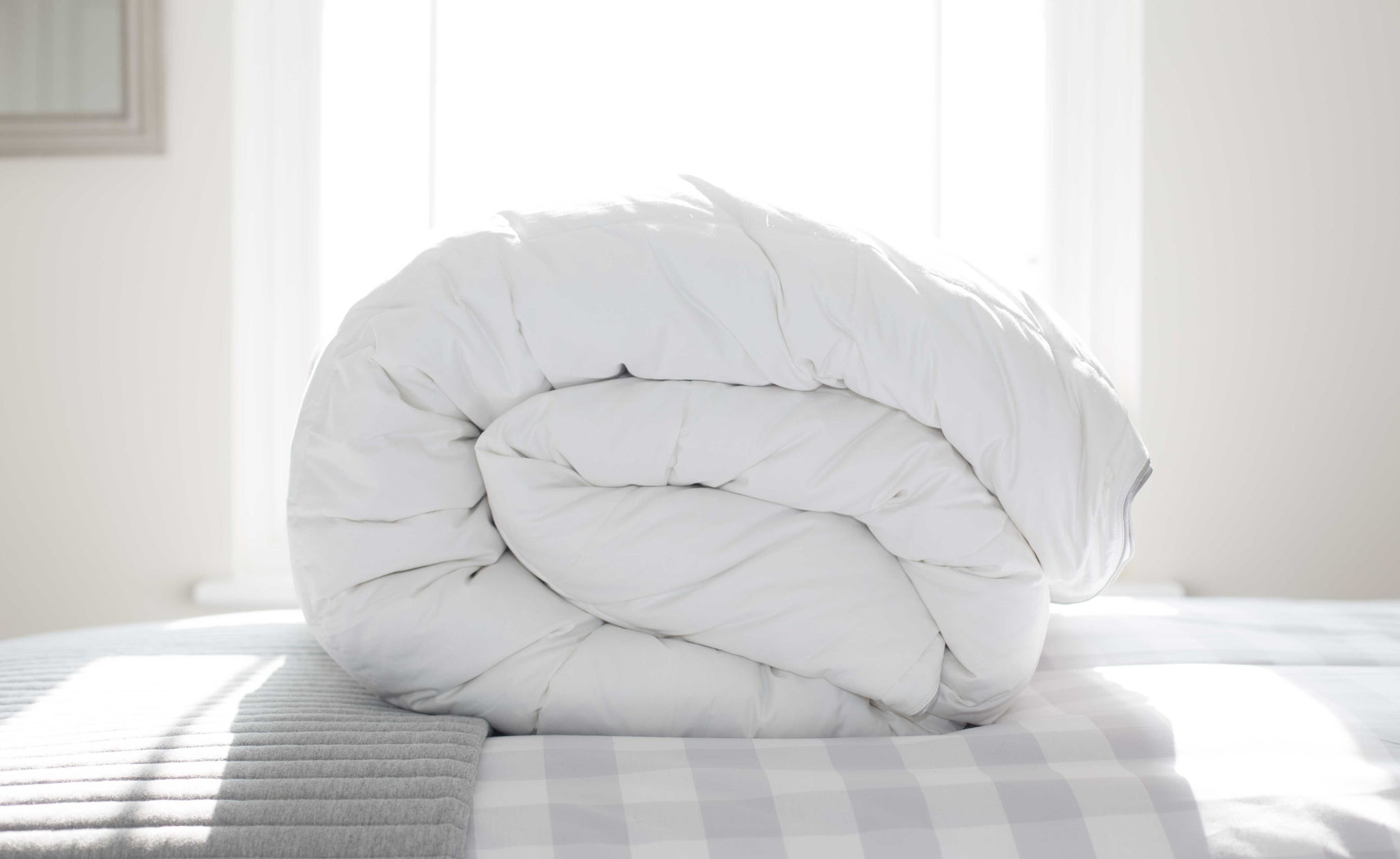 Rolled Duvet on a Check Duvet Cover in a Bedroom | scooms