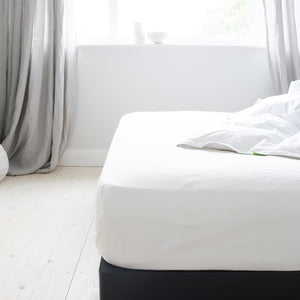 Mattress with a White Fitted Sheet | scooms