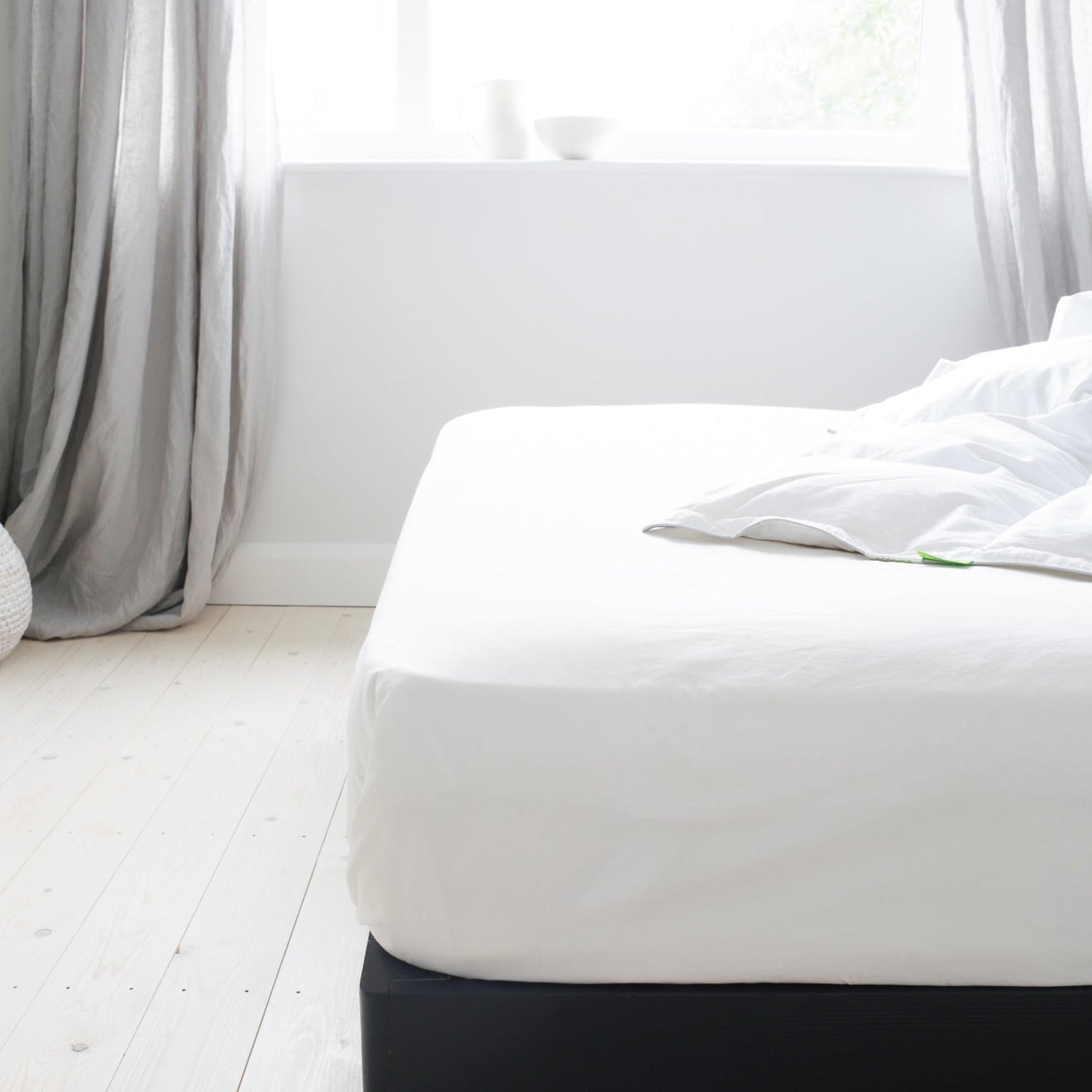 Mattress with a White Fitted Sheet | Scooms