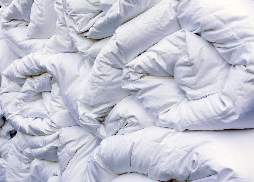 Stack of Duvets Rolled | Scooms