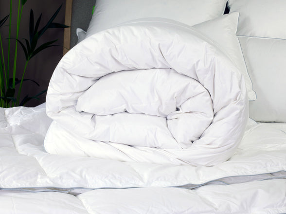 Rolled Down Duvet on Bed | scooms