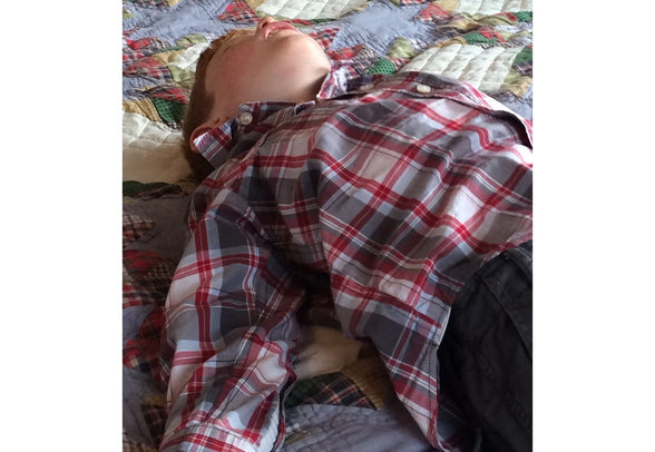 Sleeping child on Bed | Scooms