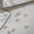 Duvet fasteners next to a duvet | Scooms