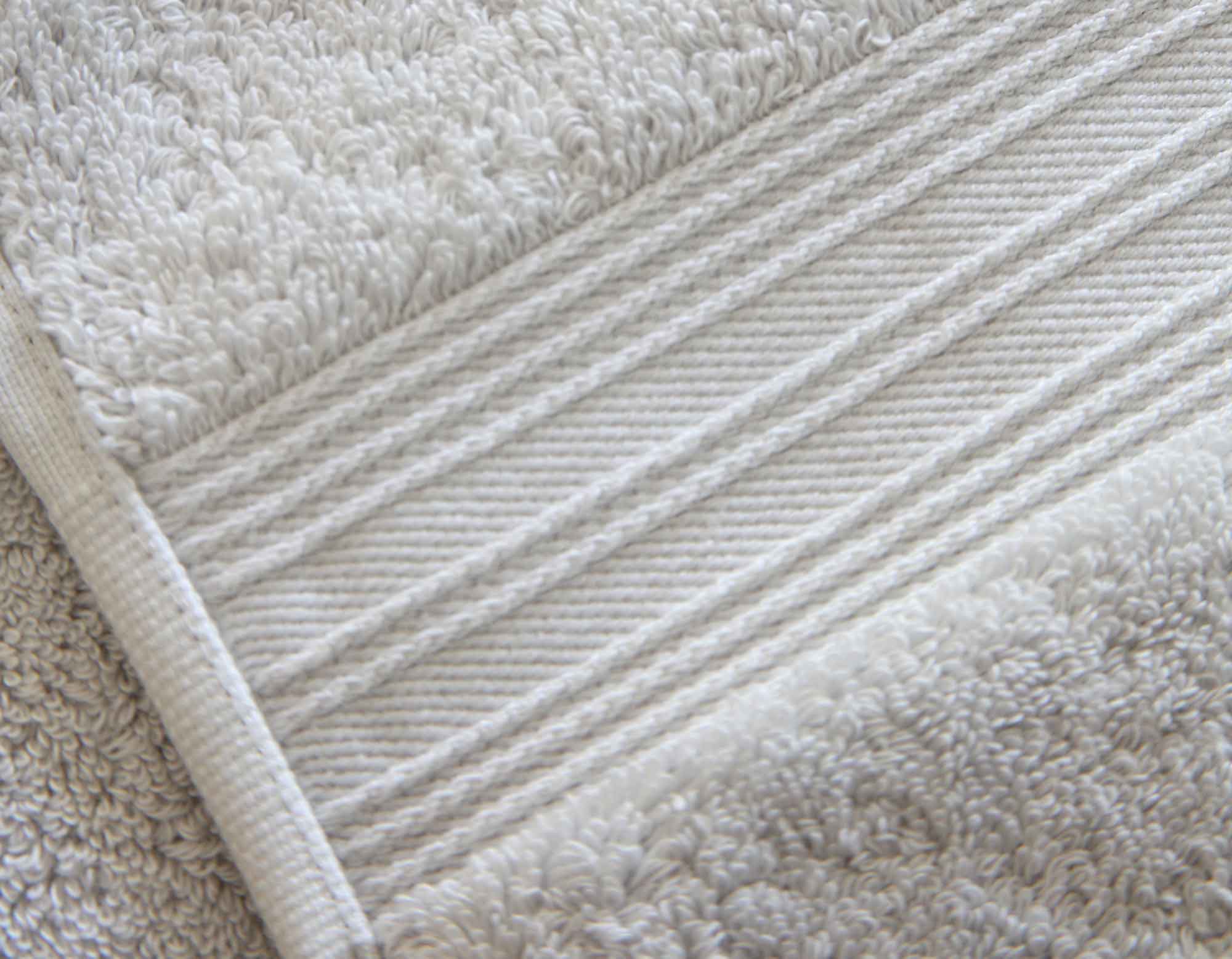 Pearl grey cotton bath sheet bundle close-up showing details of the stitching and cotton loops