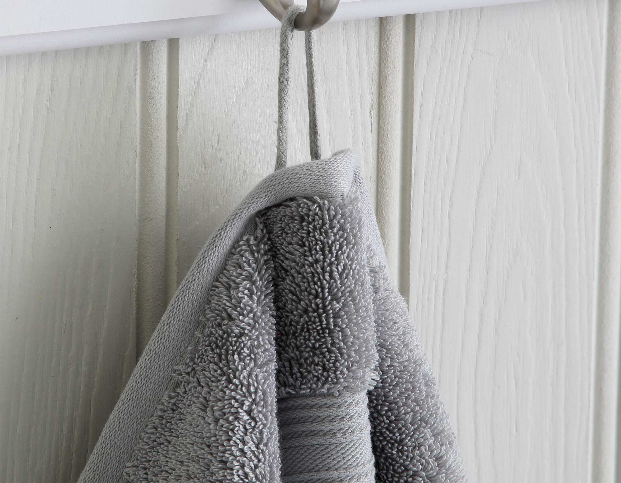 Silver grey Egyptian cotton bath sheet hanging from a hook