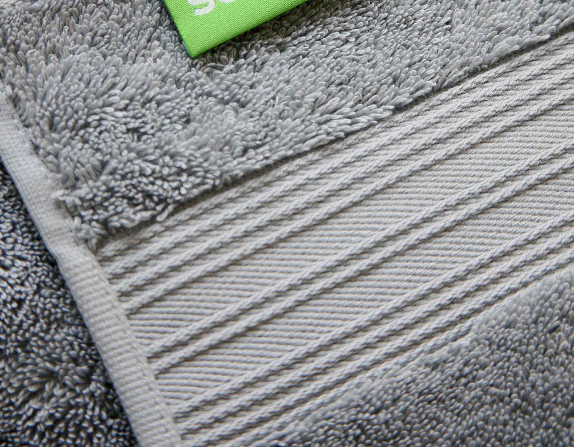 Silver grey cotton bath towel close-up showing details and scooms logo