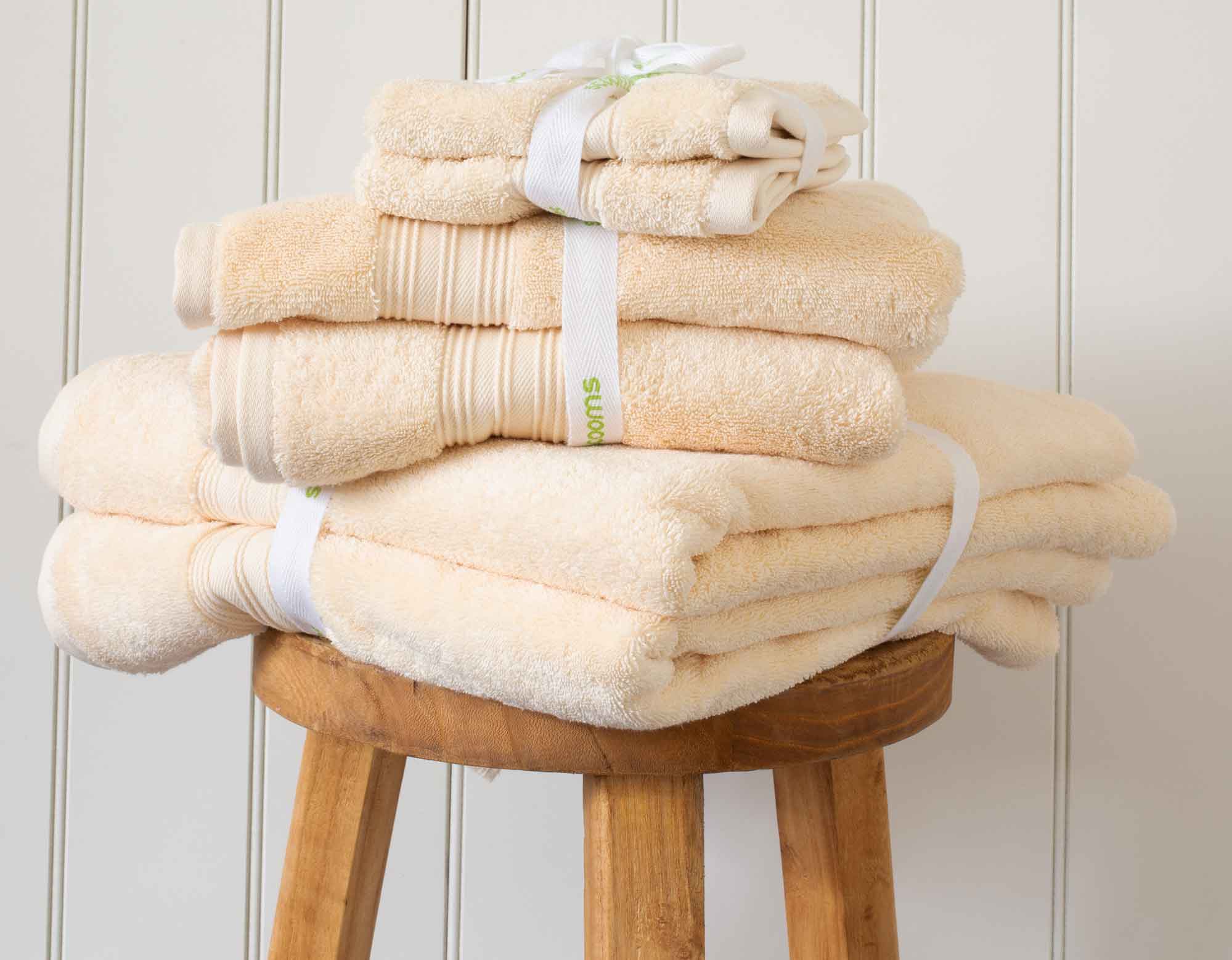 Creme Egyptian cotton face cloths and towels in pile