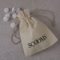 Duvet fasteners with a Scooms branded fastener bag