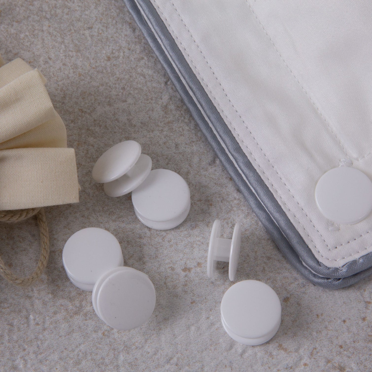 Duvet fasteners cufflink style with a duvet clipped together