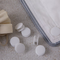 Duvet fasteners cufflink style with a duvet clipped together
