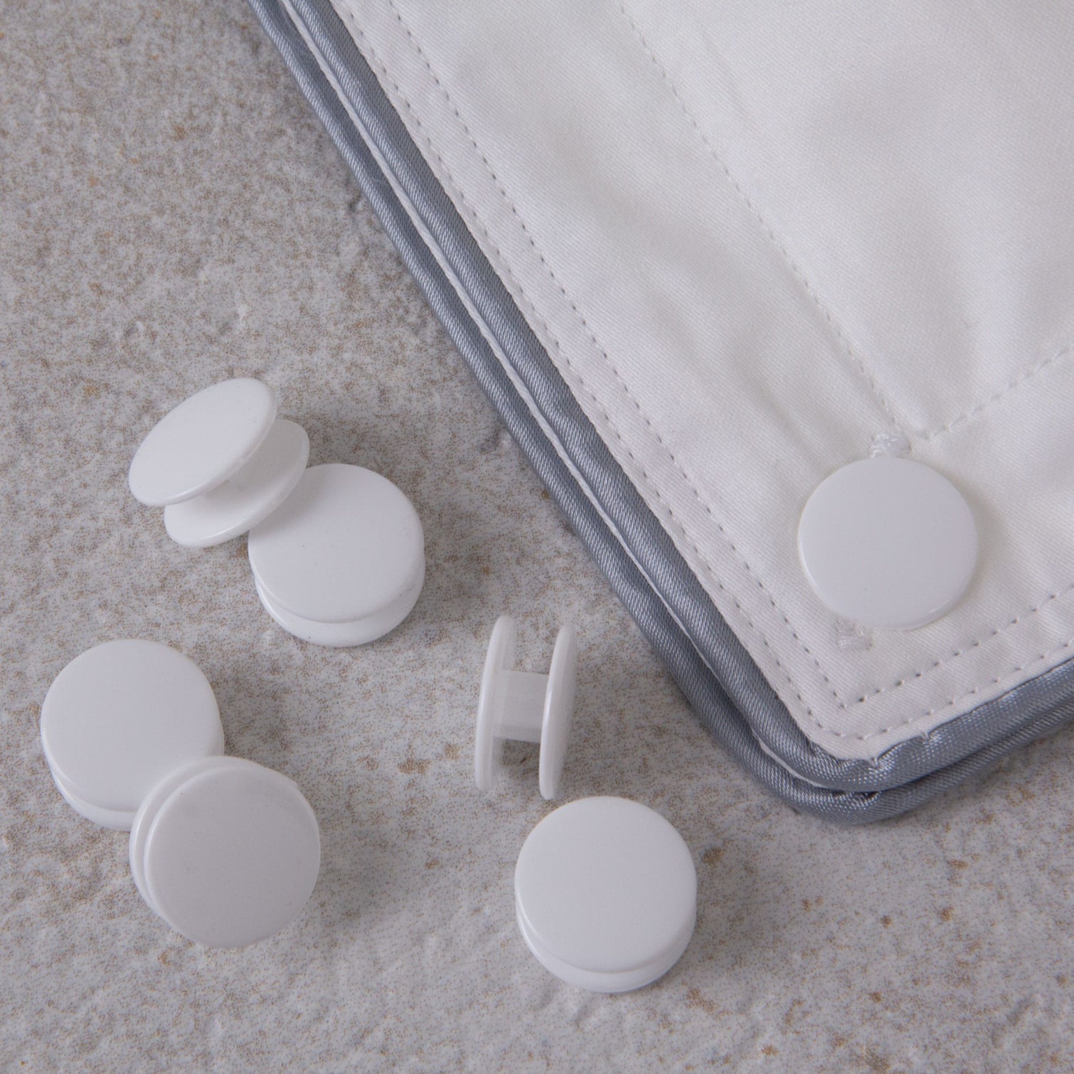 Duvet fasteners with a duvet clipped together