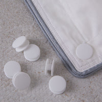 Duvet fasteners with a duvet clipped together