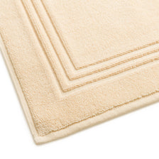 Egyptian cotton bath mat in creme corner detail. Scooms