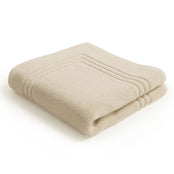 Folded Egyptian cotton natural bath mat | Scooms