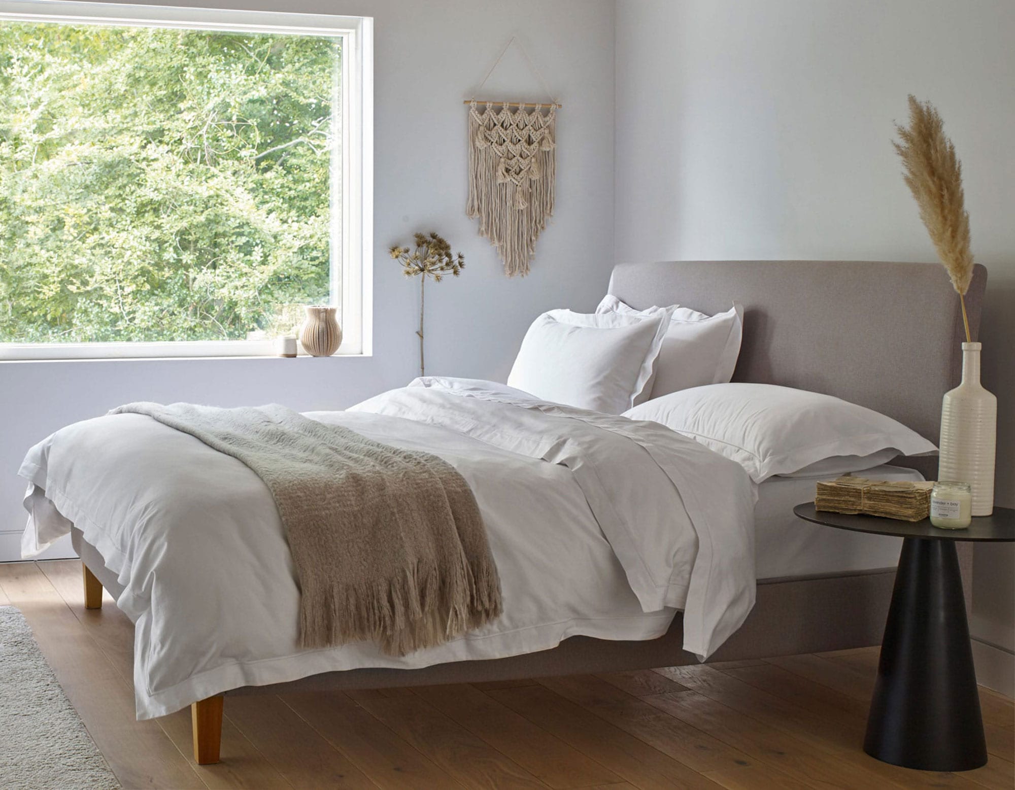 White Egyptian cotton bedding on bed in luxury bedroom