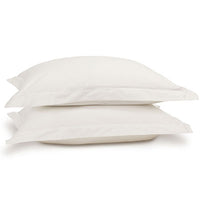 Egyptian cotton pillowcase pair in white on pillows. Scooms