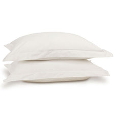 Egyptian cotton pillowcase pair in white on pillows. Scooms