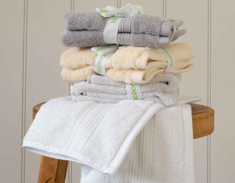 Creme Egyptian cotton face cloths and towels in pile