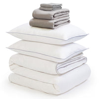 Grey linen bedding bundle consisting of a pair of pillows, an all seasons 13.5 tog (4.5 tog + 9 tog) down duvet, linen duvet cover, linen sheet and linen pillowcases. Scooms