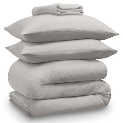 Grey linen bedding bundle consisting of a pair of pillows, an all seasons 13.5 tog (4.5 tog + 9 tog) down duvet, linen duvet cover, linen sheet and linen pillowcases. Scooms