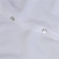 White linen duvet cover showing the button details. Scooms