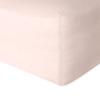 Linen fitted sheet in pink showing the corner detail. Scooms