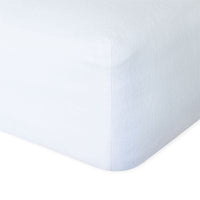 Linen fitted sheet in white showing the corner detail. Scooms