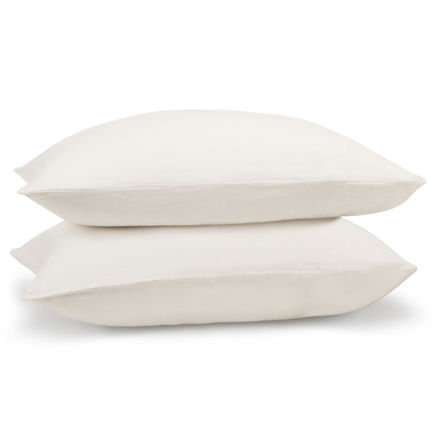White linen pillowcase pair on pillows. Scooms