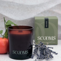 Natural scented candle in an amber glass jar with gift box, orange, lavender and leaves | Scooms