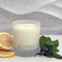 Natural scented candle in frosted glass jar next to a lemon, mint and lavender | Scooms