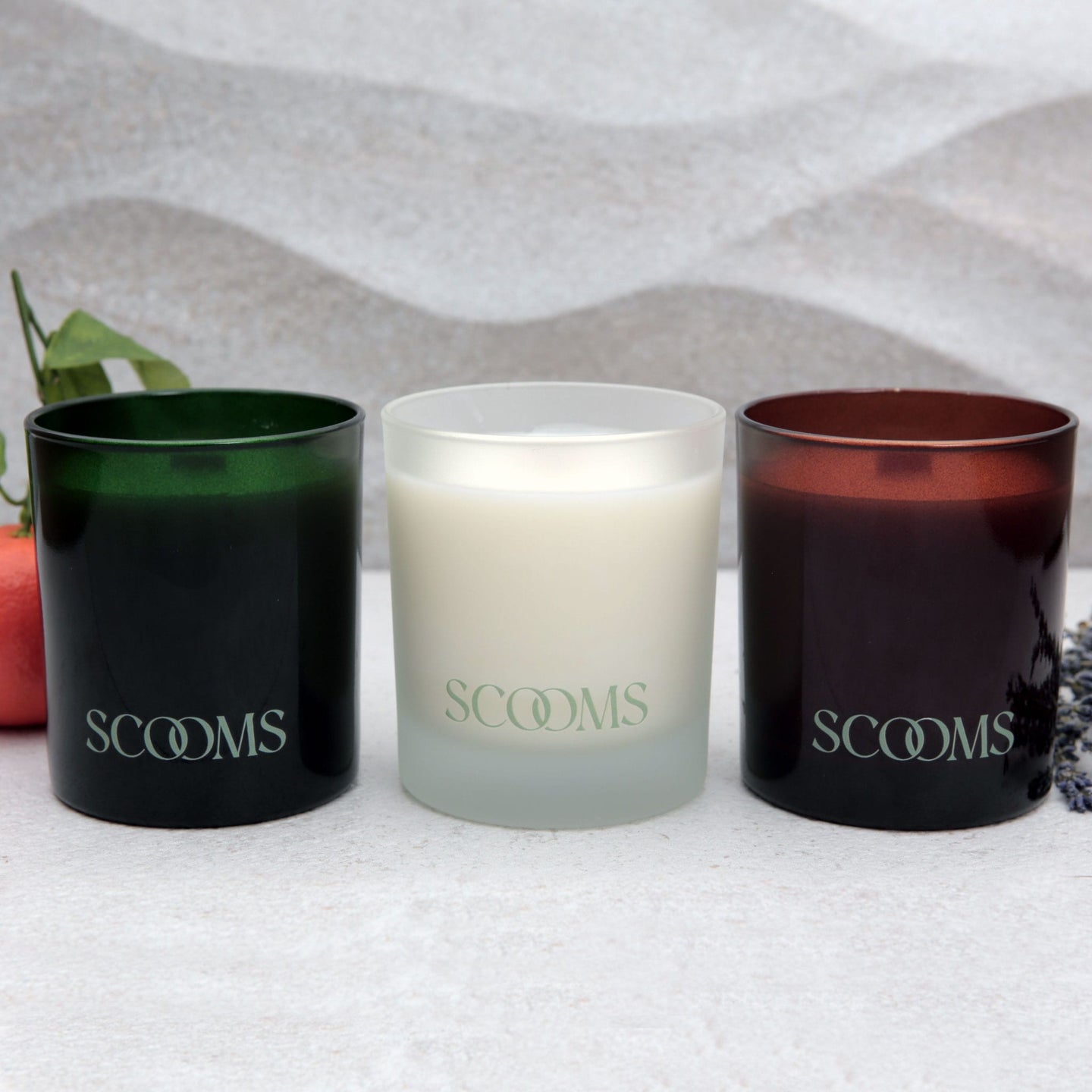 Three Sccoms natural scented candles in reusable glass jars