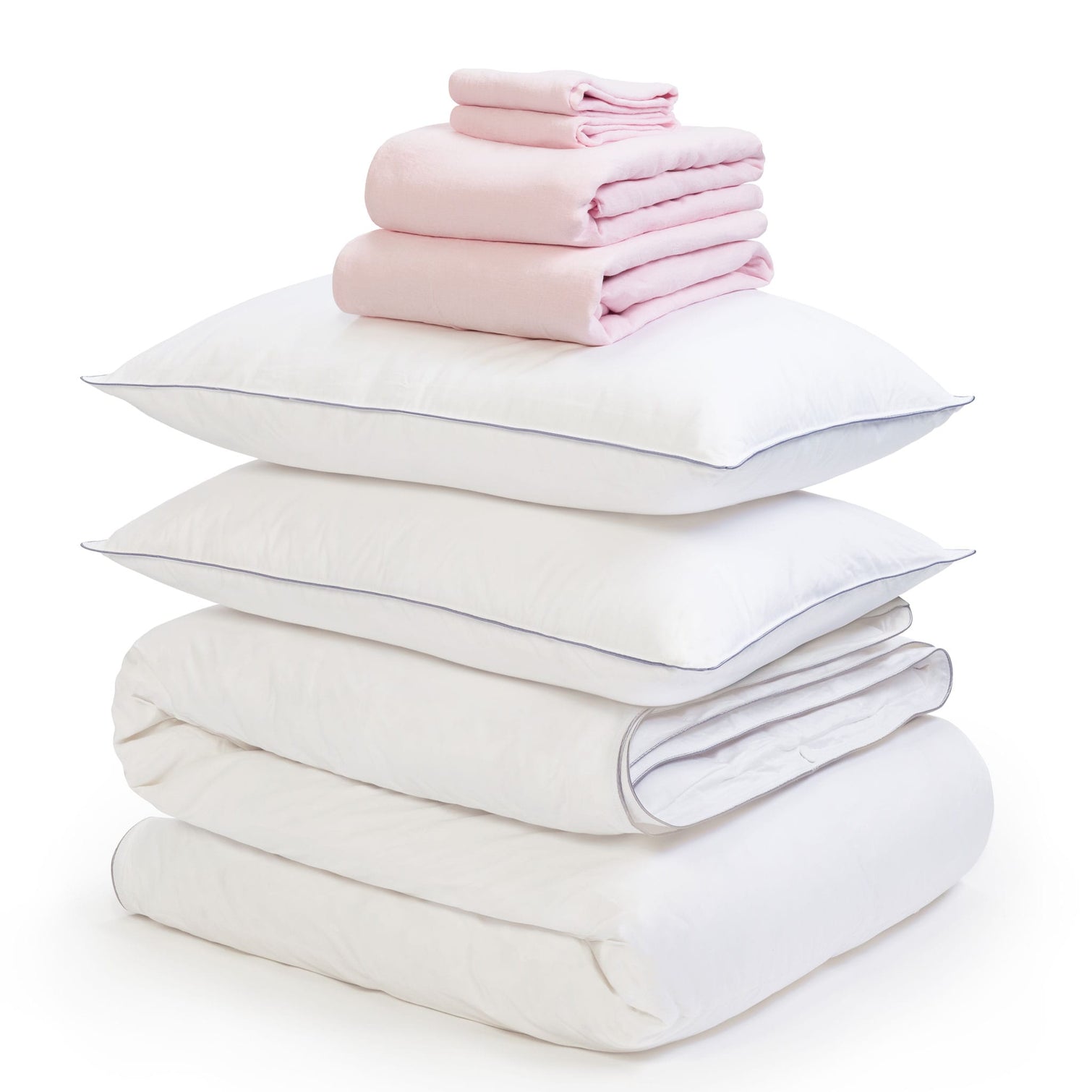Pink linen bedding bundle consisting of a pair of pillows, an all seasons 13.5 tog (4.5 tog + 9 tog) down duvet linen duvet cover, linen sheet and linen pillowcases. Scooms
