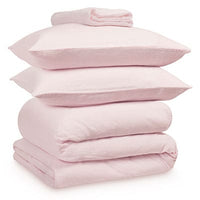 Pink linen bedding bundle consisting of a pair of pillows, an all seasons 13.5 tog (4.5 tog + 9 tog) down duvet, linen duvet cover, linen sheet and linen pillowcases. Scooms