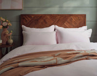 Pink Linen Sheets on Bed with a Throw