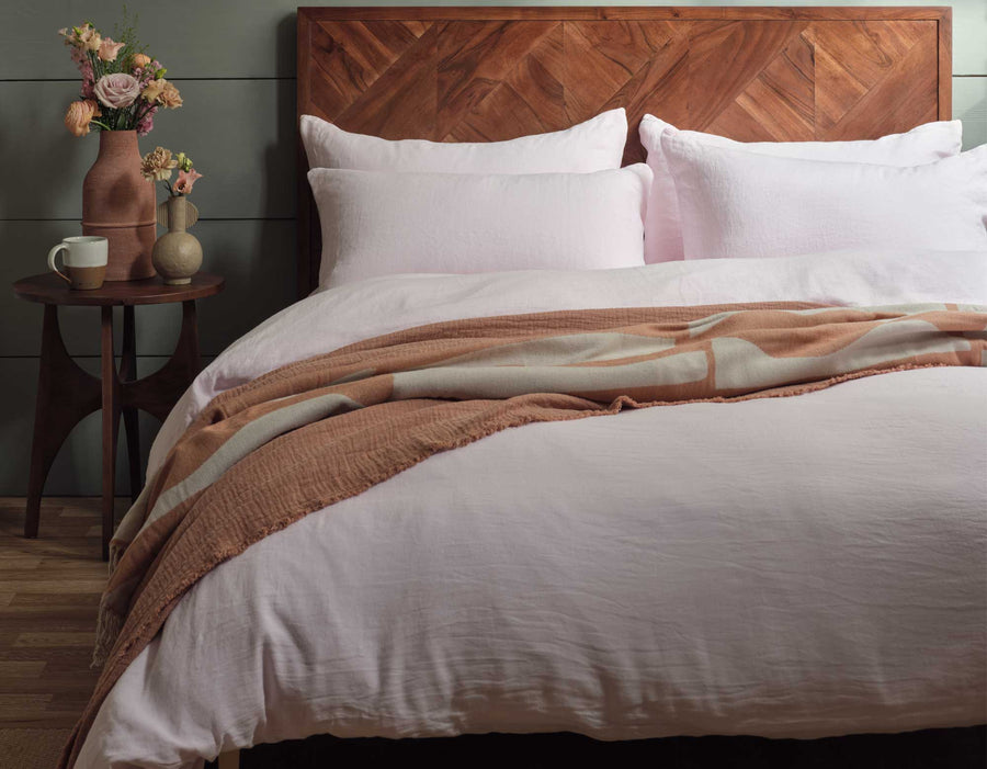 Linen Sheets in Pink on Wooden Bed