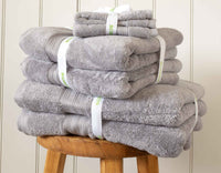 Silver grey Egyptian cotton face cloths and towels in pile