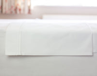 White superking size flat sheet folded showing oxford border with marrow stitching | scooms