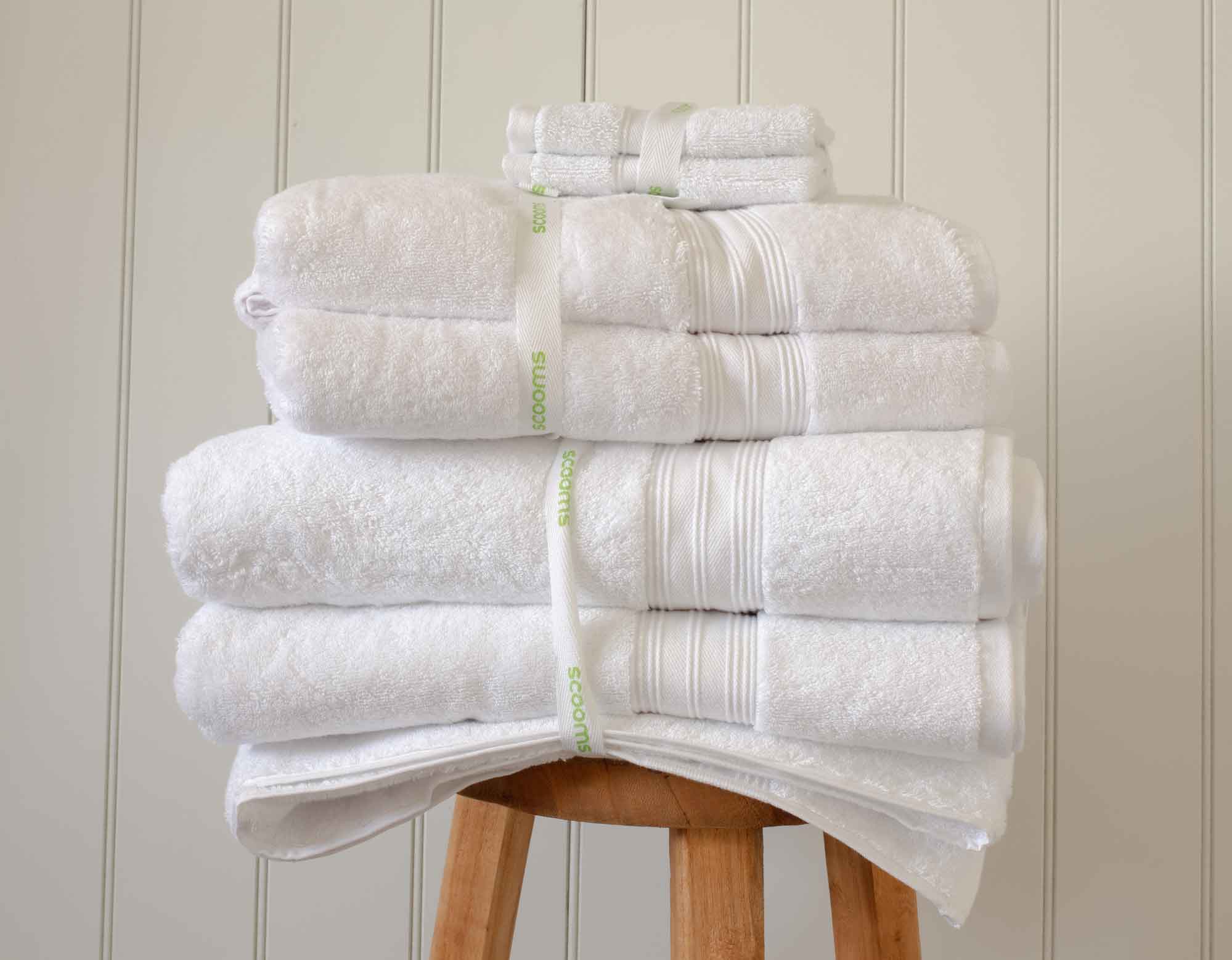 White Egyptian cotton face cloths and towels in pile