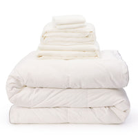 White linen bedding bundle consisting of an all seasons 13.5 tog (4.5 tog + 9 tog) down duvet, linen duvet cover, linen sheet and linen pillowcases. Scooms