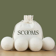 Wool dryer balls with a Scooms branded cotton storage bag .Scooms
