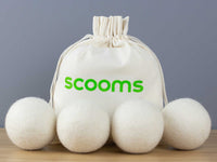 Four wool dryers balls with scooms branded bag