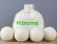 Four wool dryers balls with scooms branded bag