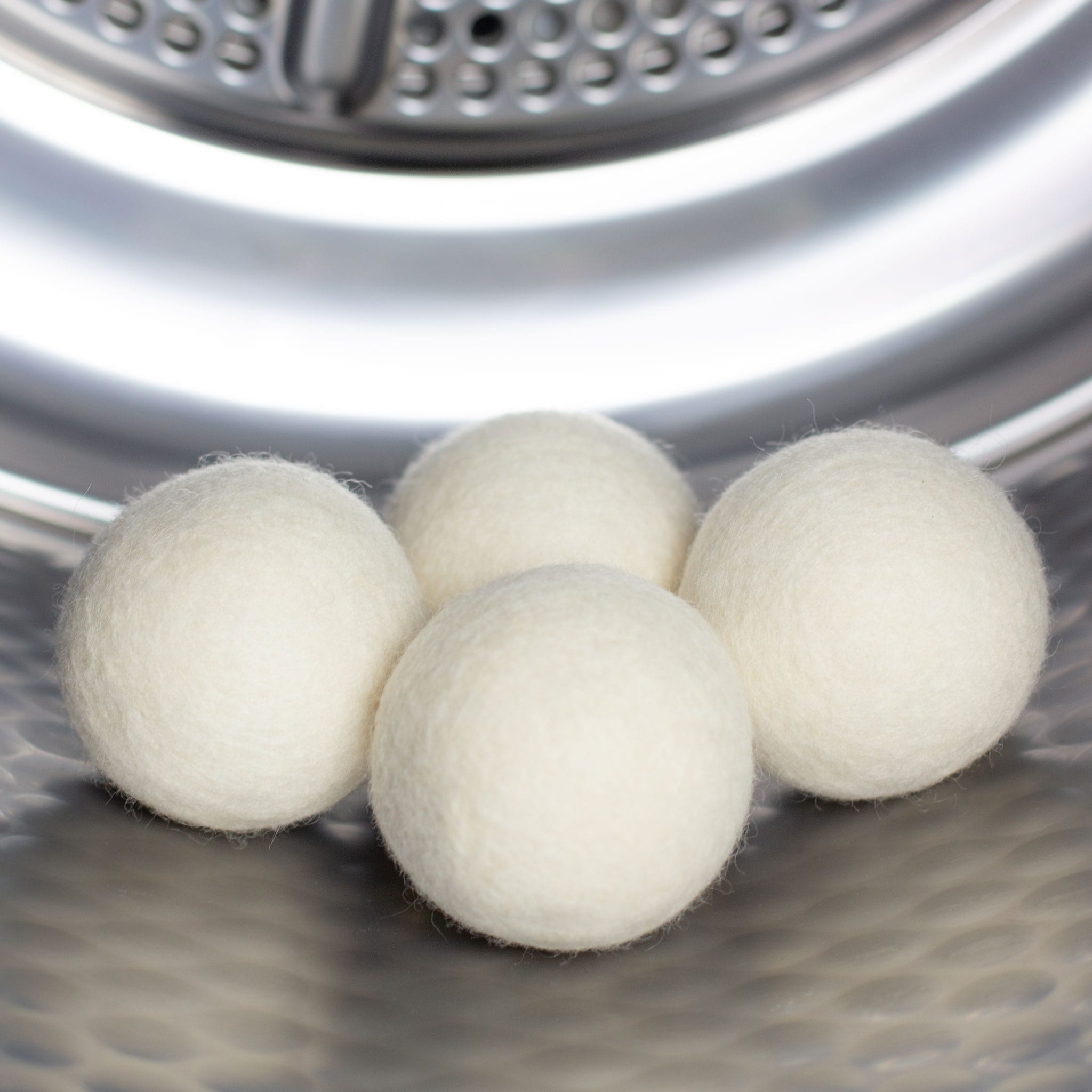 Wool dryer balls in a tumble dryer. Scooms